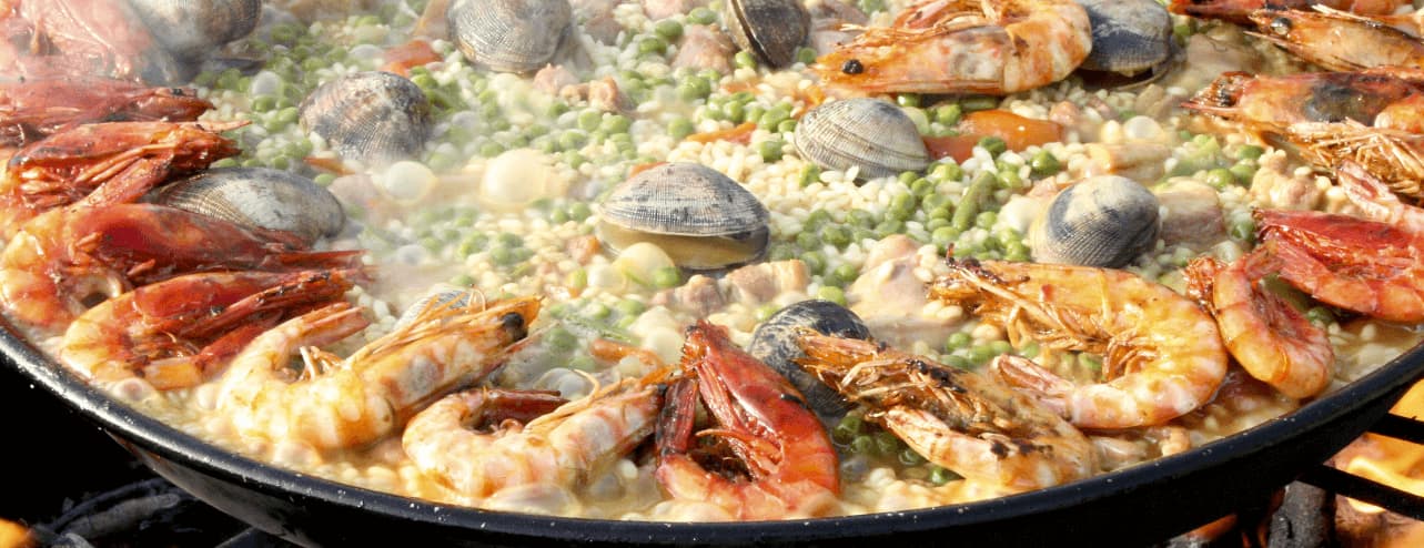 Paella essen und spanisch lernen